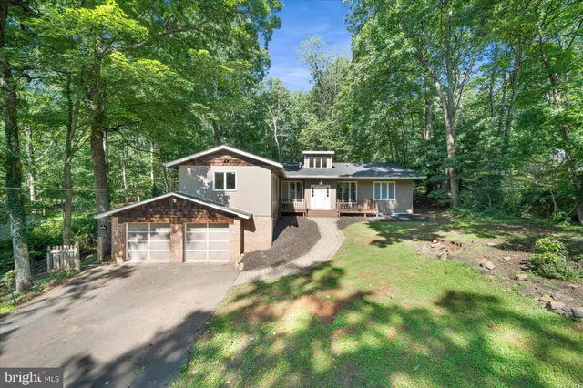 a view of a wooden deck with chairs
