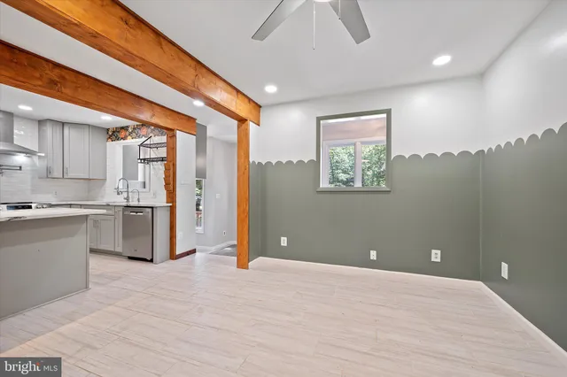 a view of a hallway with wooden floor and glass doors