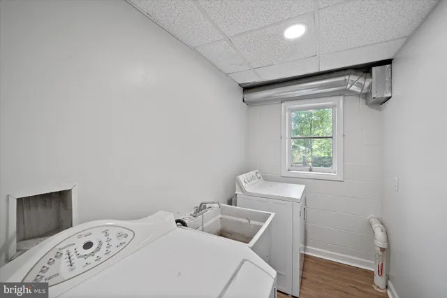 a view of an empty room and wooden floor