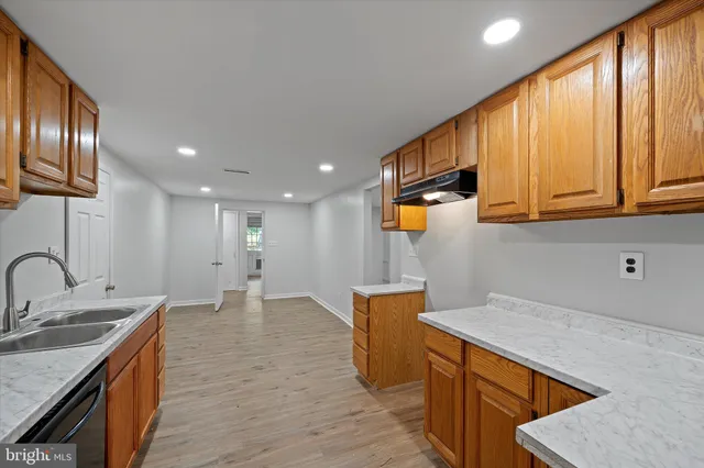 a white toilet sitting next to a shower curtain