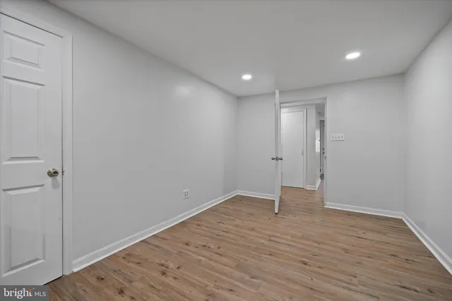 a view of balcony with wooden floor and fence