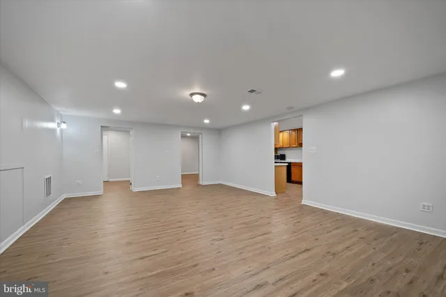 a view of a swimming pool with a garden and trees