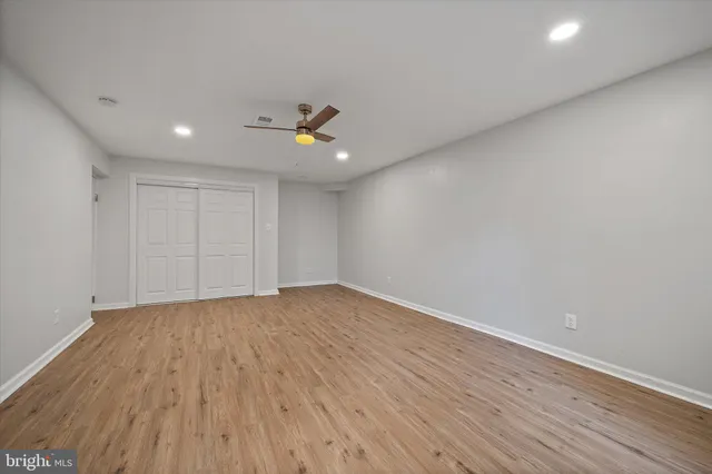 a view of a lush green field with a mountain in the background