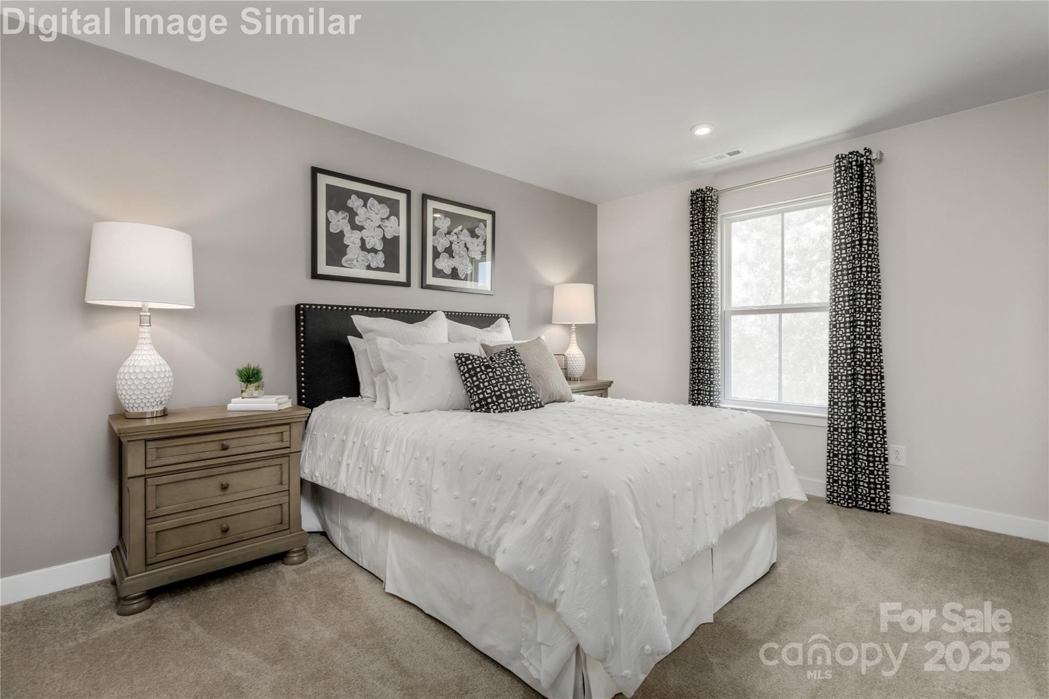 9551 Teamwork Street Northwest Concord, NC 28027 - Photo 12 of 23 a bedroom with a bed and a window