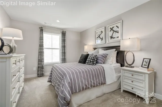 a bedroom with a bed and cabinets