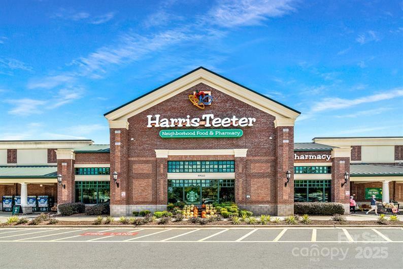 9551 Teamwork Street Northwest Concord, NC 28027 - Photo 21 of 23 a sign board on the side of a street