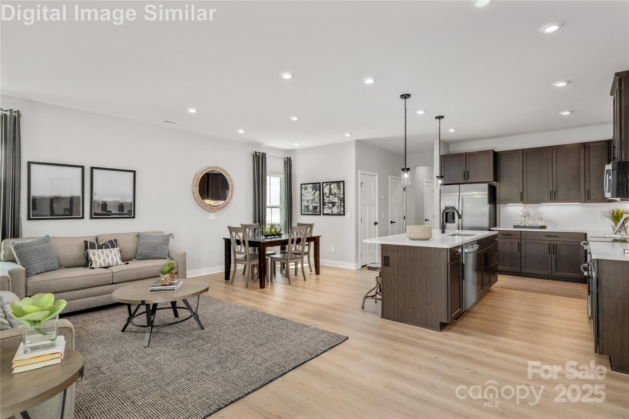 9551 Teamwork Street Northwest Concord, NC 28027 - Photo 5 of 23 a living room with furniture and a large window