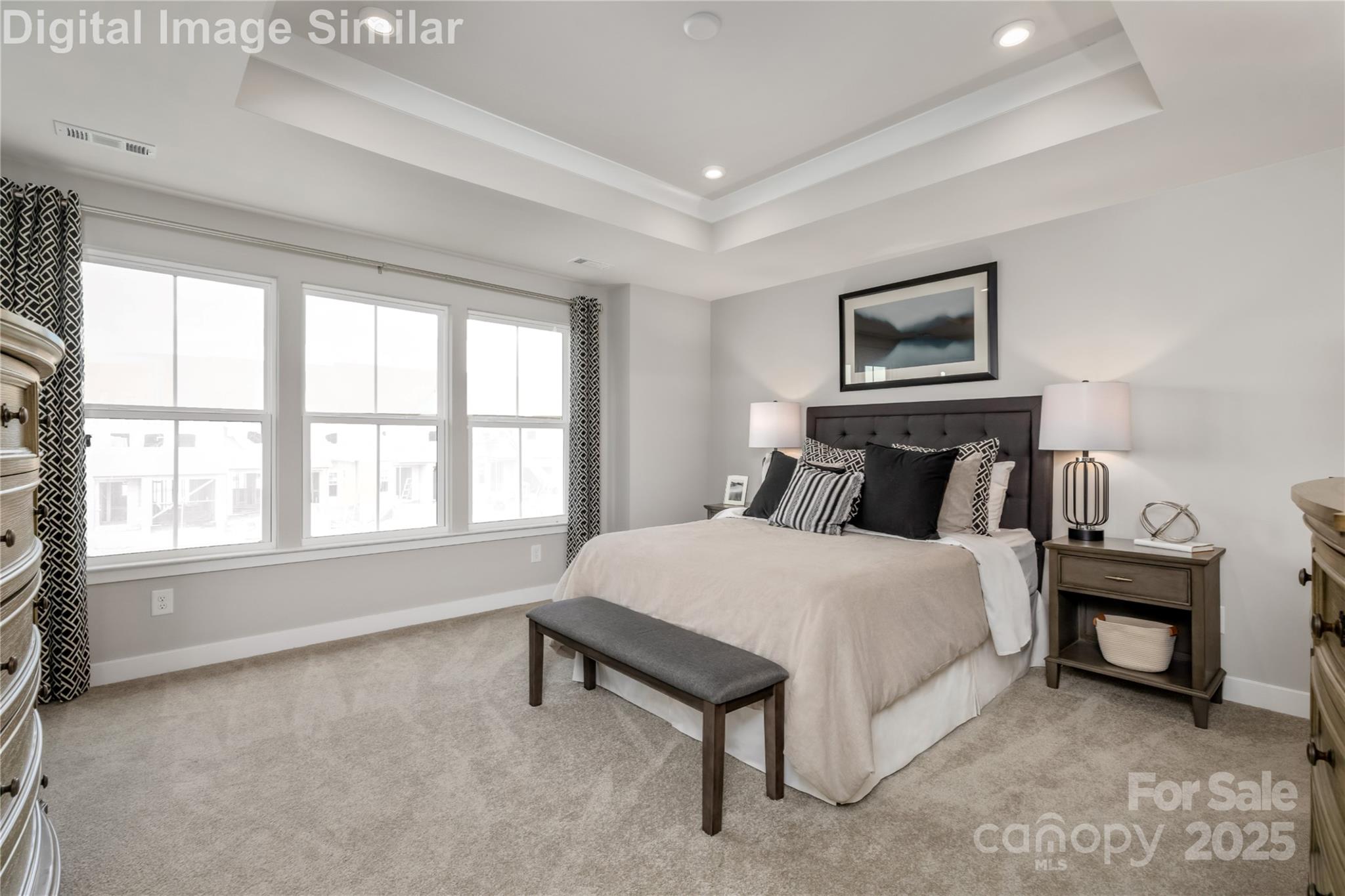 9551 Teamwork Street Northwest Concord, NC 28027 - Photo 8 of 23 a bedroom with a bed a table and painting