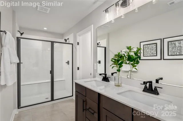 a bathroom with a shower sink and mirror