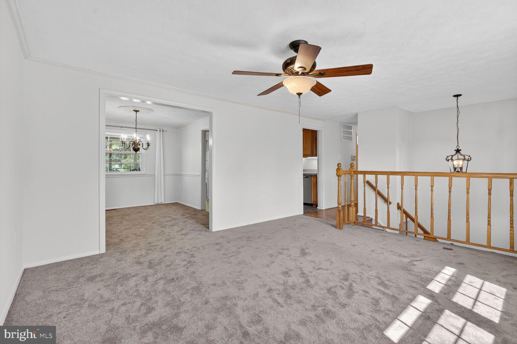 2806 Logway Road Vienna, VA 22181 - Photo 4 of 33 a view of a hallway with a chandelier