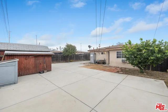 a view of a house with a backyard and a garage