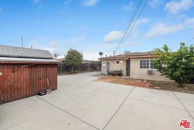 a view of a house with a backyard and a garage
