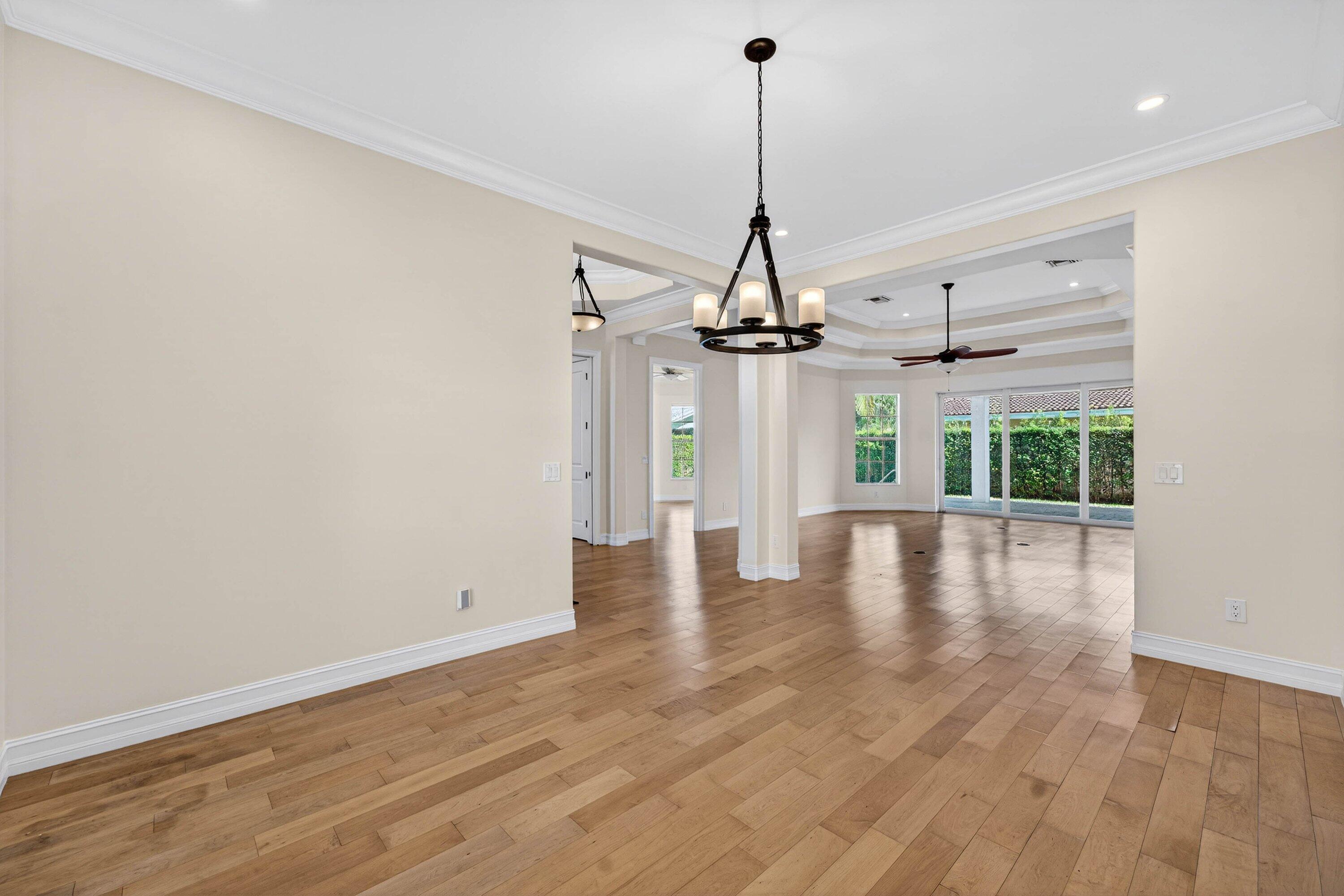 2920 Spanish River Road Boca Raton, FL 33432 - Photo 15 of 75 a view of a room with wooden floor ceiling fan and window