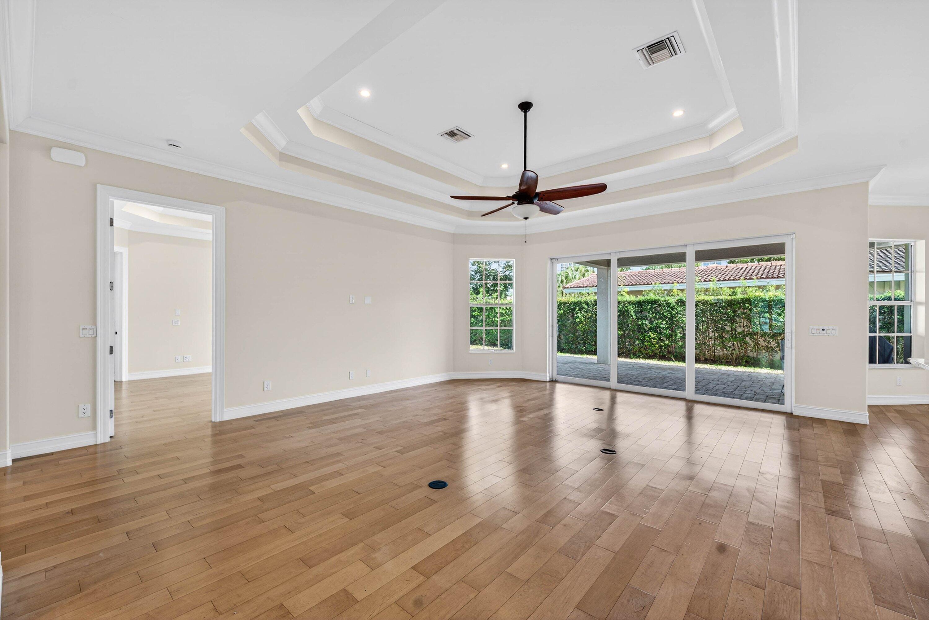 2920 Spanish River Road Boca Raton, FL 33432 - Photo 19 of 75 a view of an empty room with wooden floor and a window