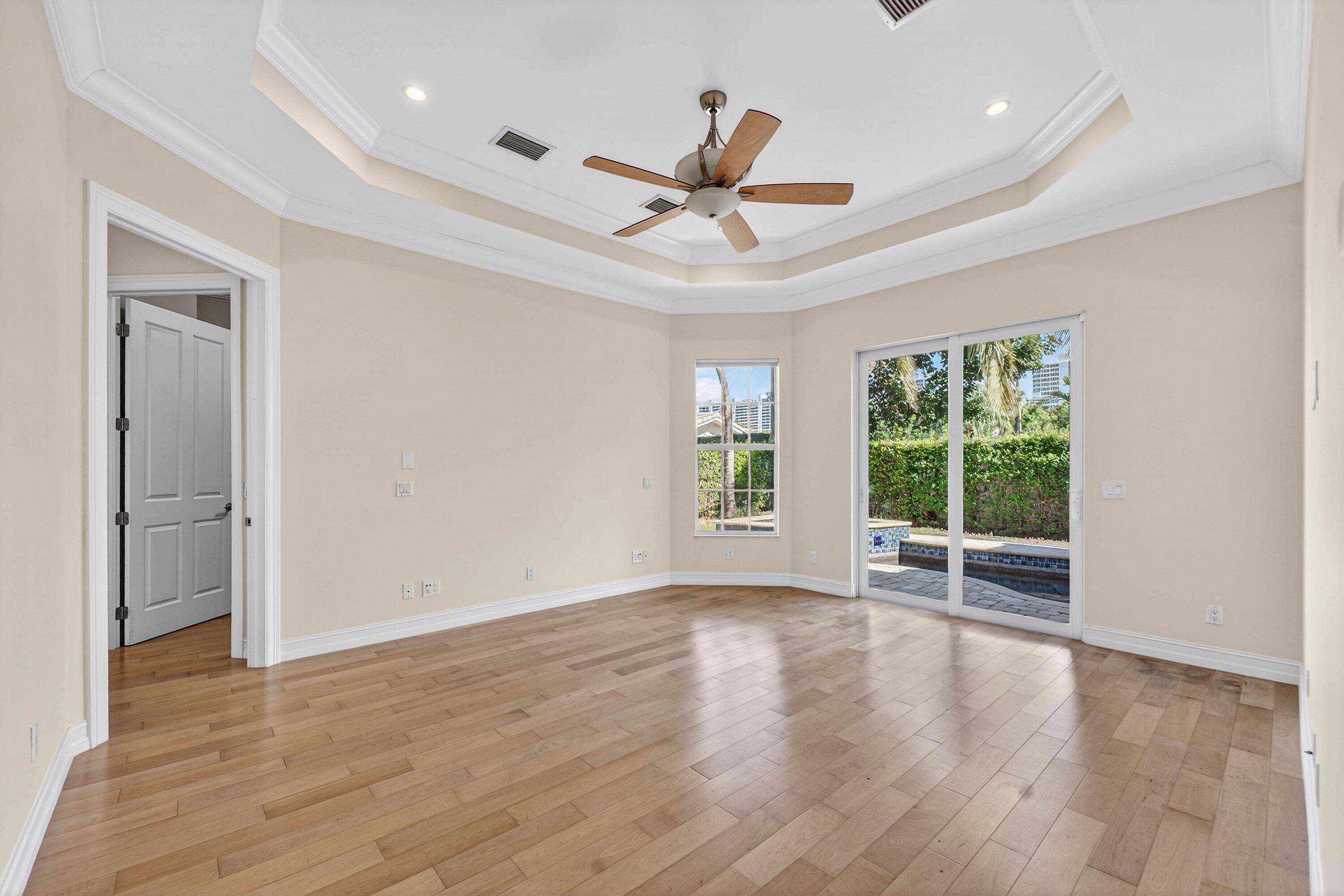 2920 Spanish River Road Boca Raton, FL 33432 - Photo 29 of 75 a view of an empty room with wooden floor and a window