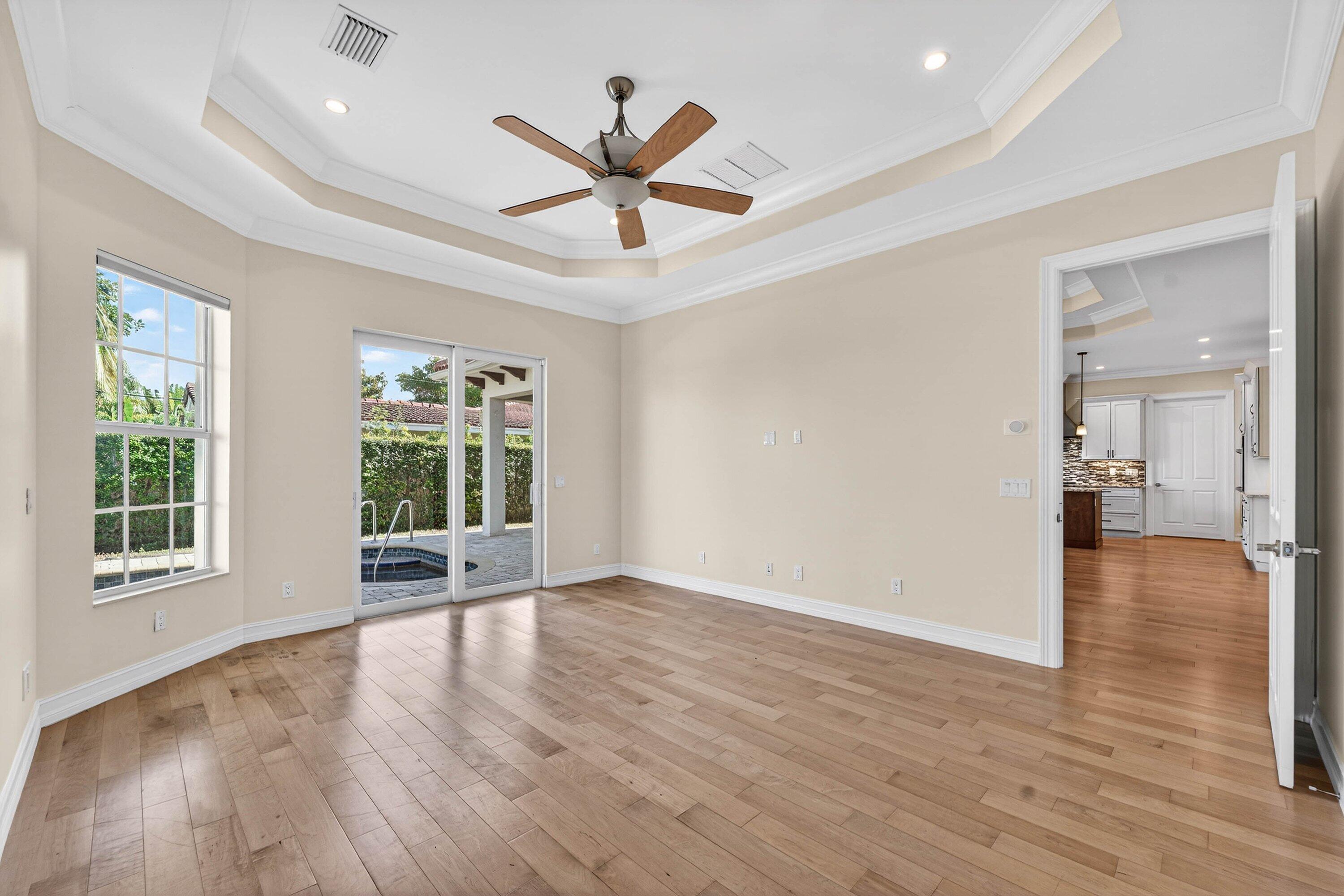 2920 Spanish River Road Boca Raton, FL 33432 - Photo 31 of 75 an empty room with wooden floor and windows
