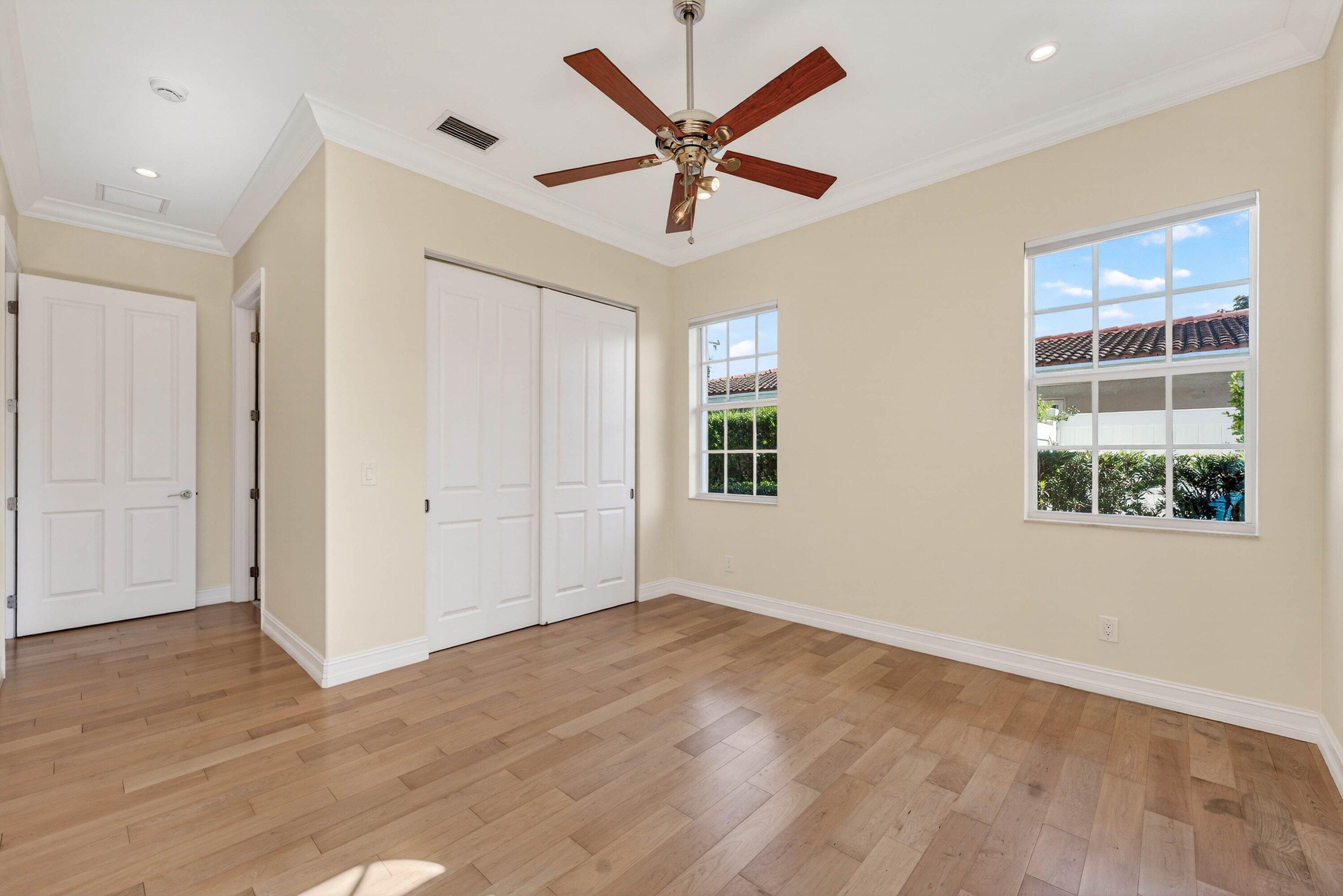 2920 Spanish River Road Boca Raton, FL 33432 - Photo 40 of 75 wooden floor in an empty room with a window