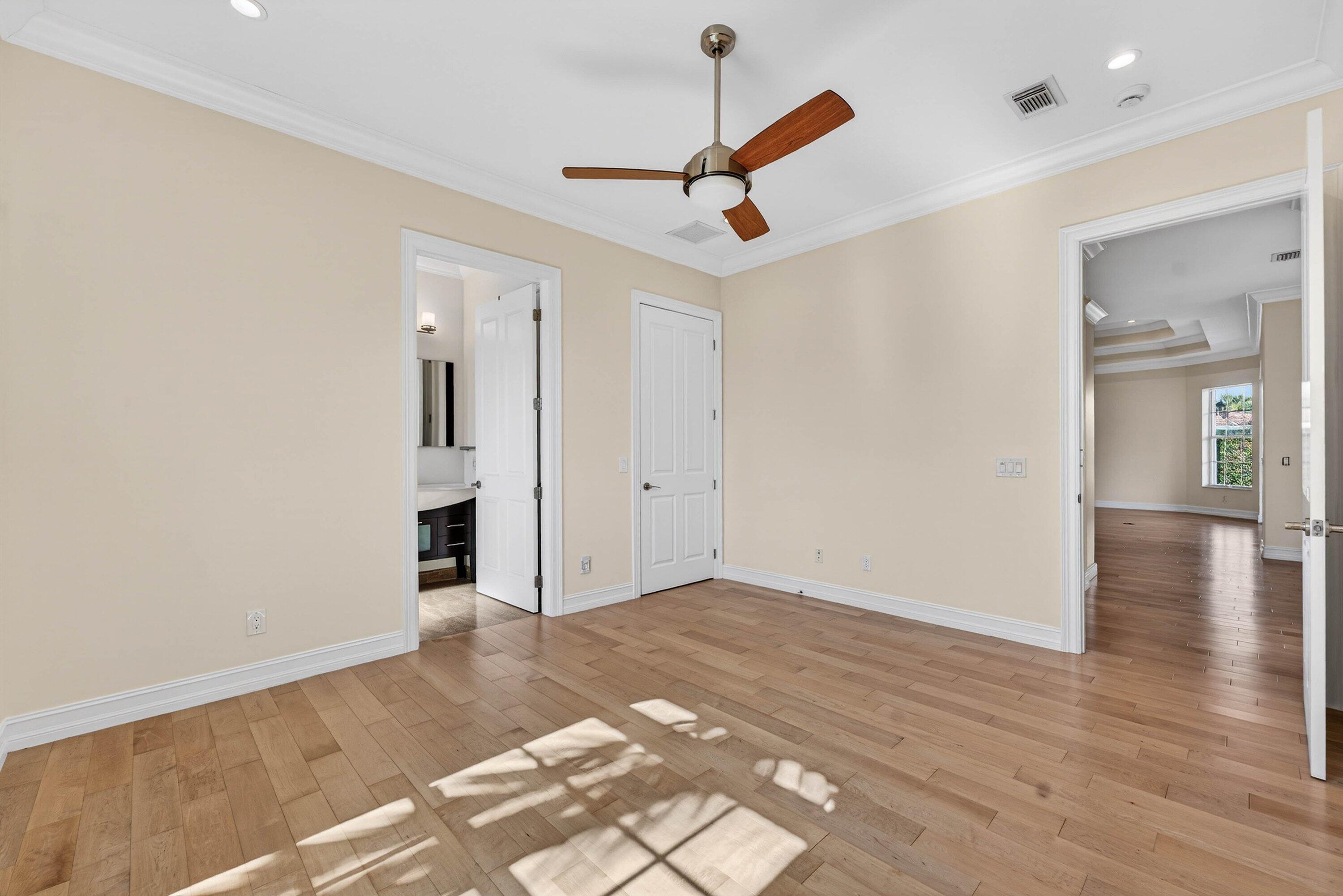 2920 Spanish River Road Boca Raton, FL 33432 - Photo 45 of 75 wooden floor in an empty room with a window