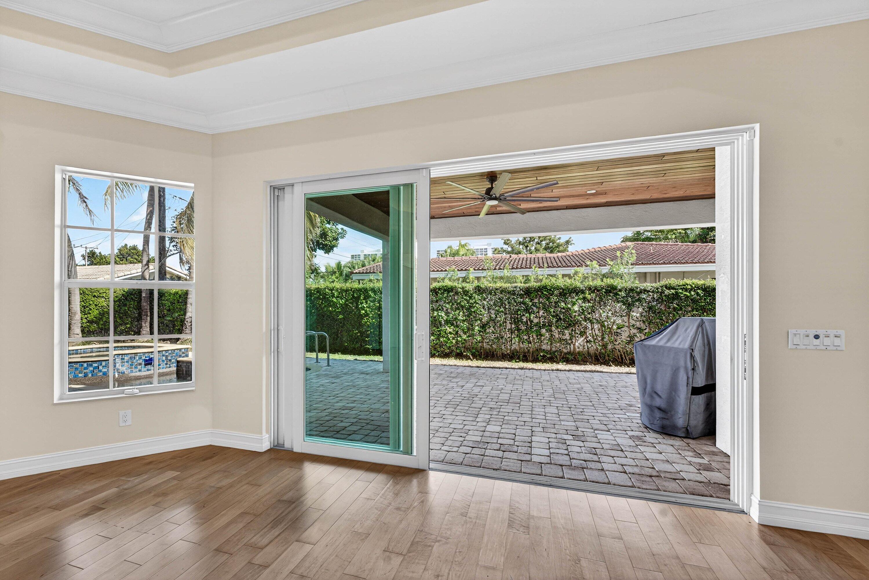 2920 Spanish River Road Boca Raton, FL 33432 - Photo 51 of 75 a view of an empty room with wooden floor and a window