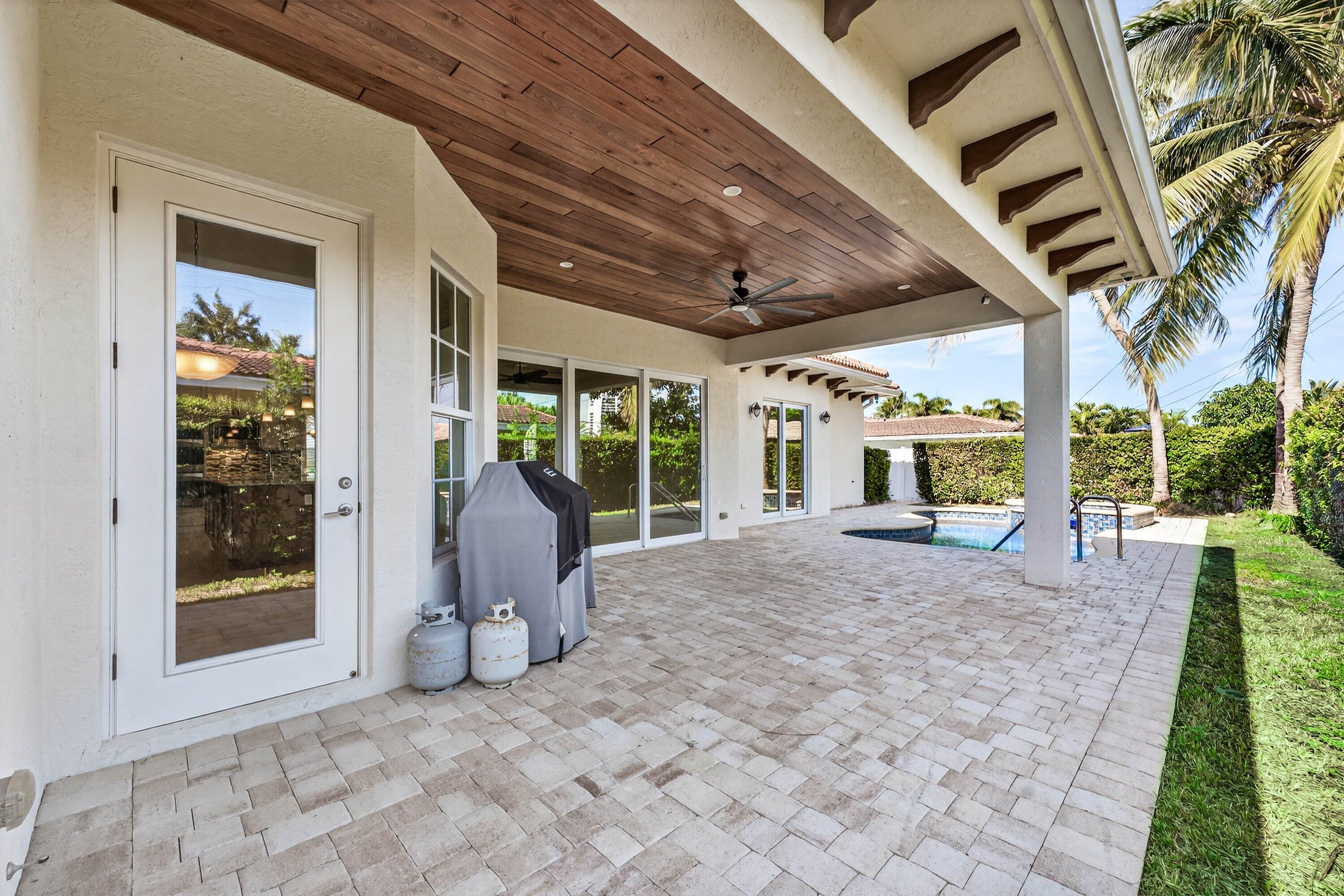 2920 Spanish River Road Boca Raton, FL 33432 - Photo 55 of 75 a view of a porch with furniture and garden