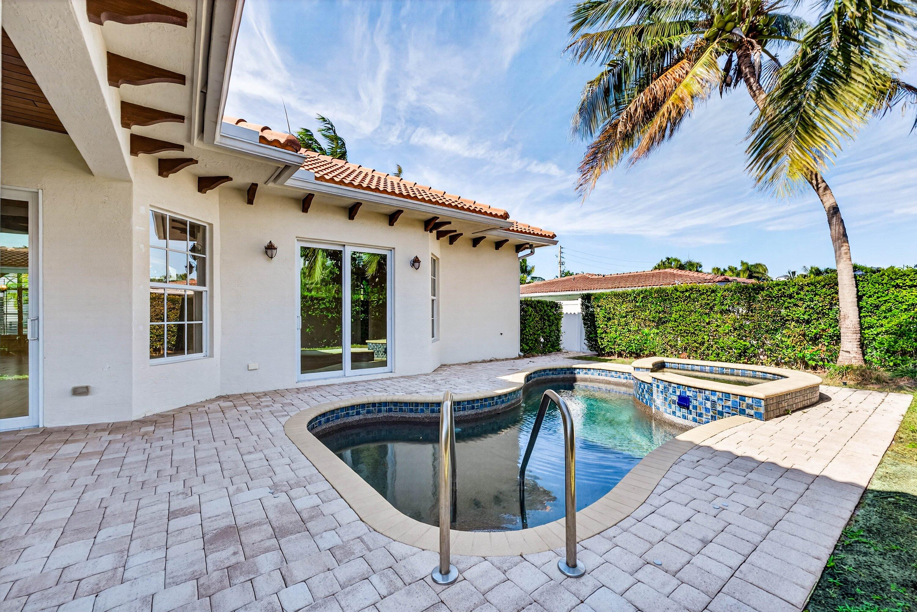 2920 Spanish River Road Boca Raton, FL 33432 - Photo 56 of 75 a view of a house with pool and sitting area