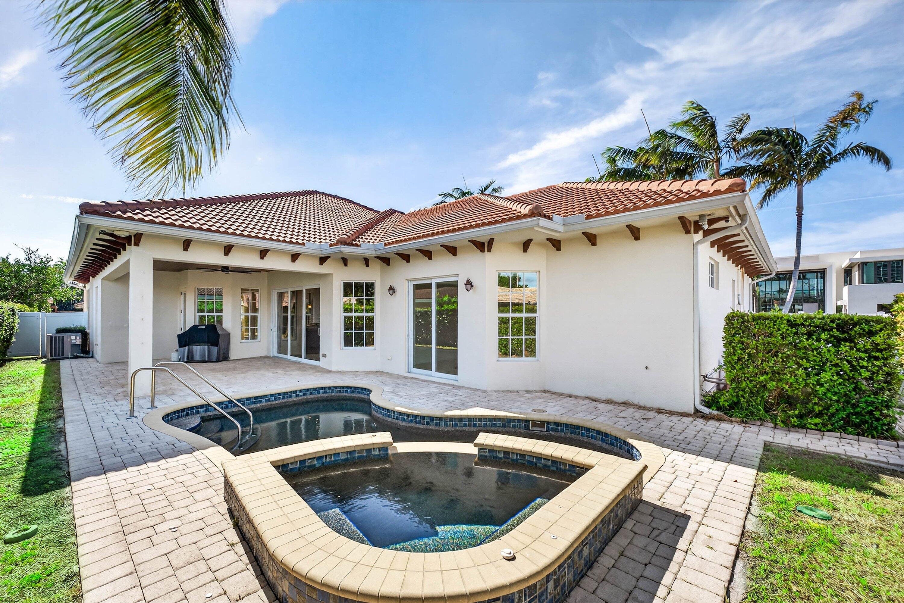 2920 Spanish River Road Boca Raton, FL 33432 - Photo 57 of 75 a view of house with swimming pool outdoor seating