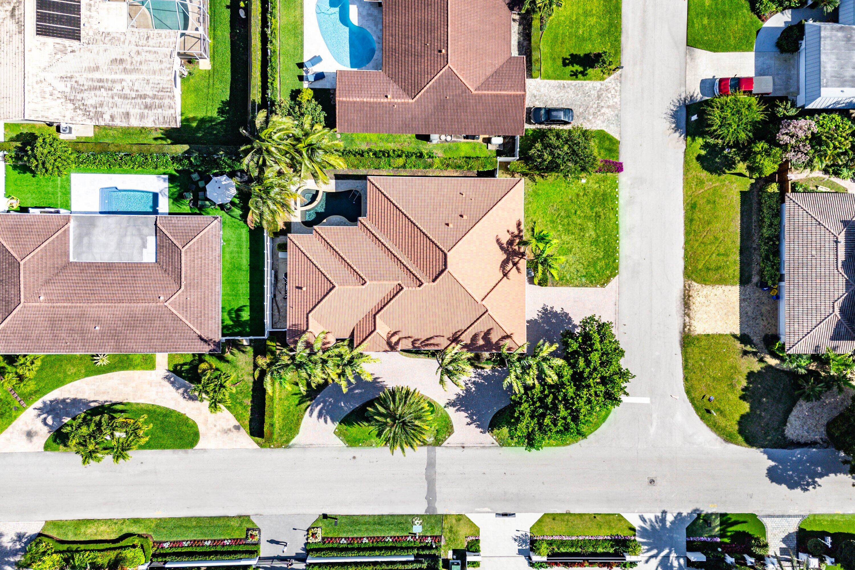 2920 Spanish River Road Boca Raton, FL 33432 - Photo 63 of 75 an aerial view of a house with a lot of flower plants