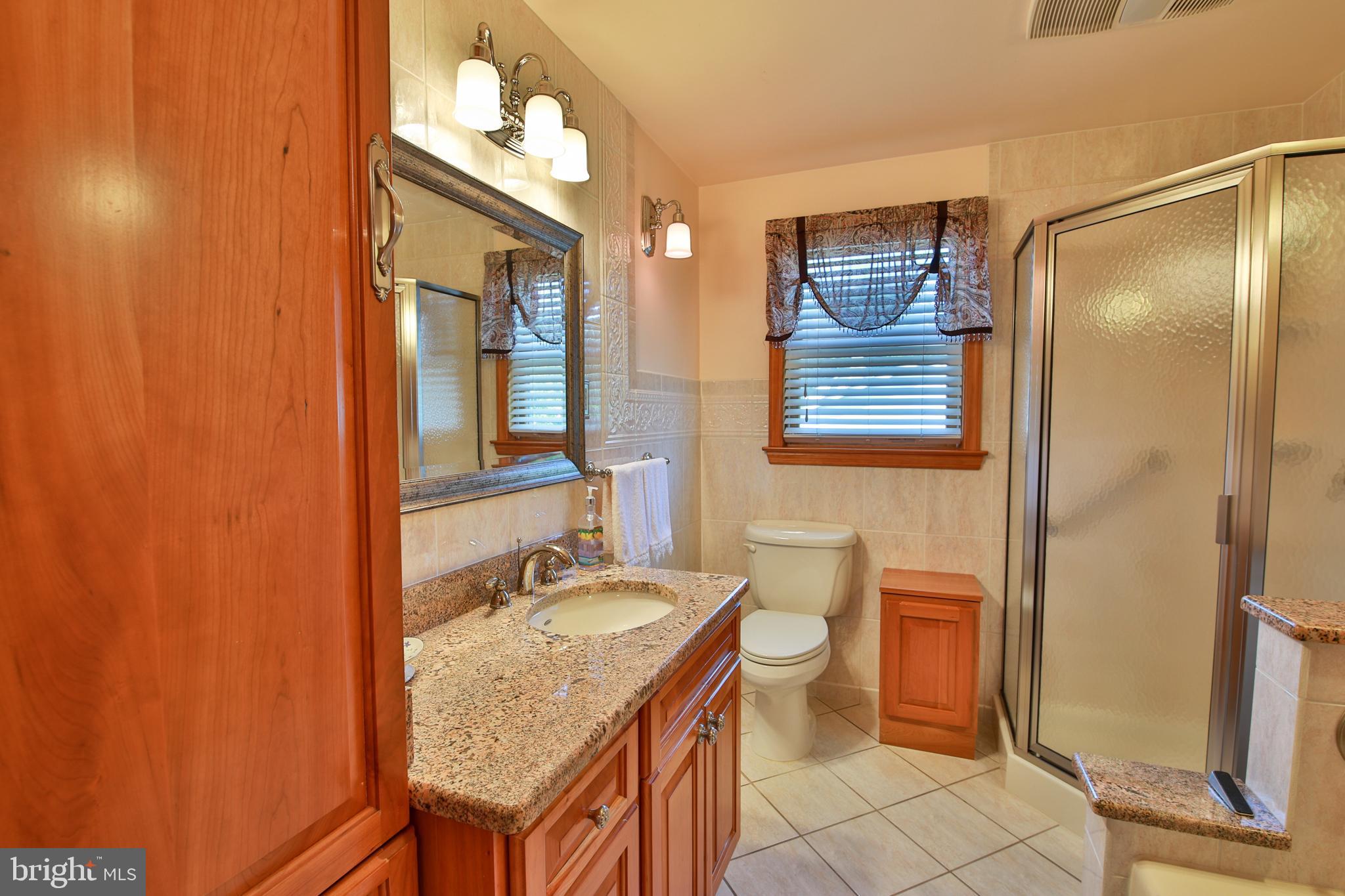 9922 Philadelphia Road Baltimore, MD 21237 - Photo 18 of 44 Renovated bathroom with custom cabinets