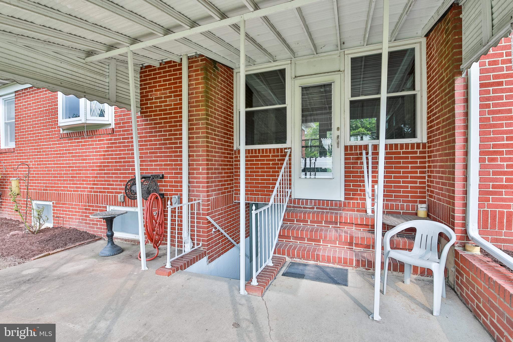 9922 Philadelphia Road Baltimore, MD 21237 - Photo 40 of 44 Covered rear patio, and covered stairs to basement