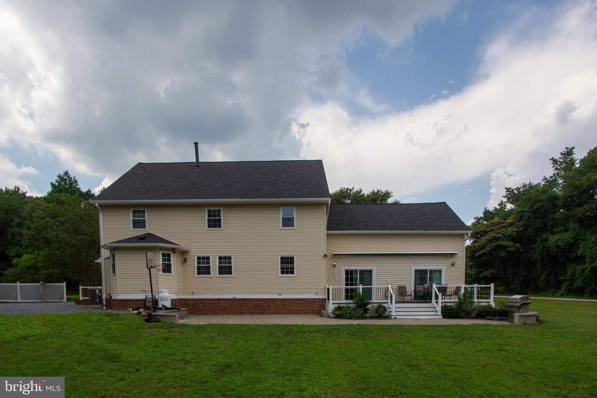 911 South Wieker Road Severn, MD 21144 - Photo 13 of 73 a big white house with a big yard and more windows