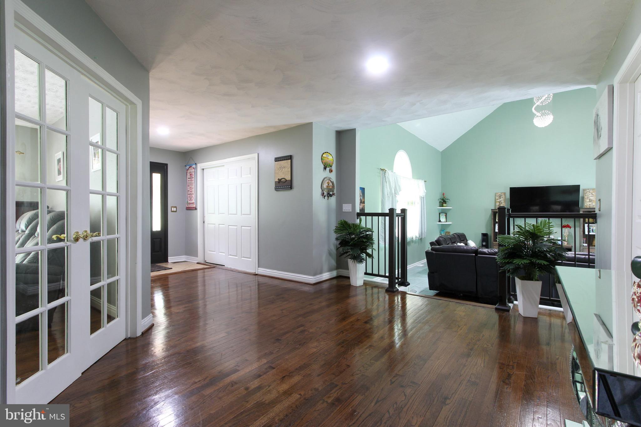 911 South Wieker Road Severn, MD 21144 - Photo 23 of 73 a view of a living room with wooden floor