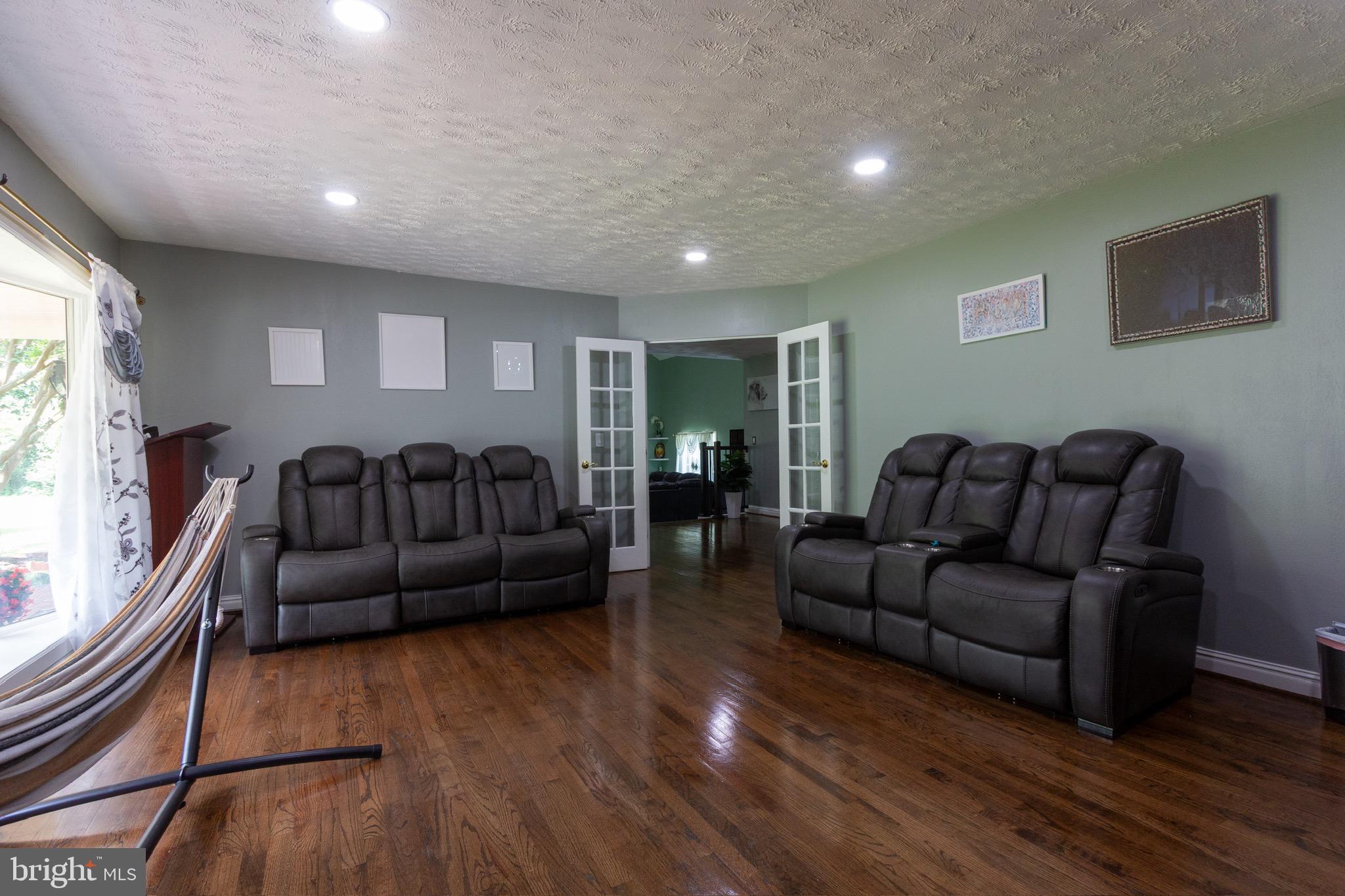 911 South Wieker Road Severn, MD 21144 - Photo 25 of 73 a living room with furniture and a wooden floor