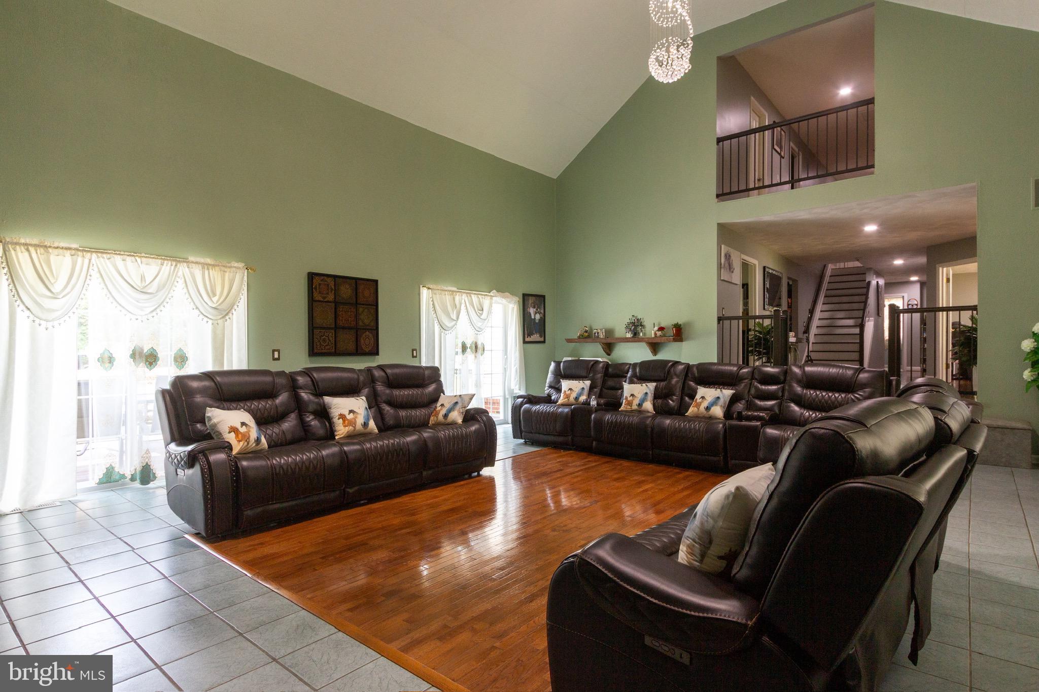 911 South Wieker Road Severn, MD 21144 - Photo 27 of 73 a living room with furniture and a large window