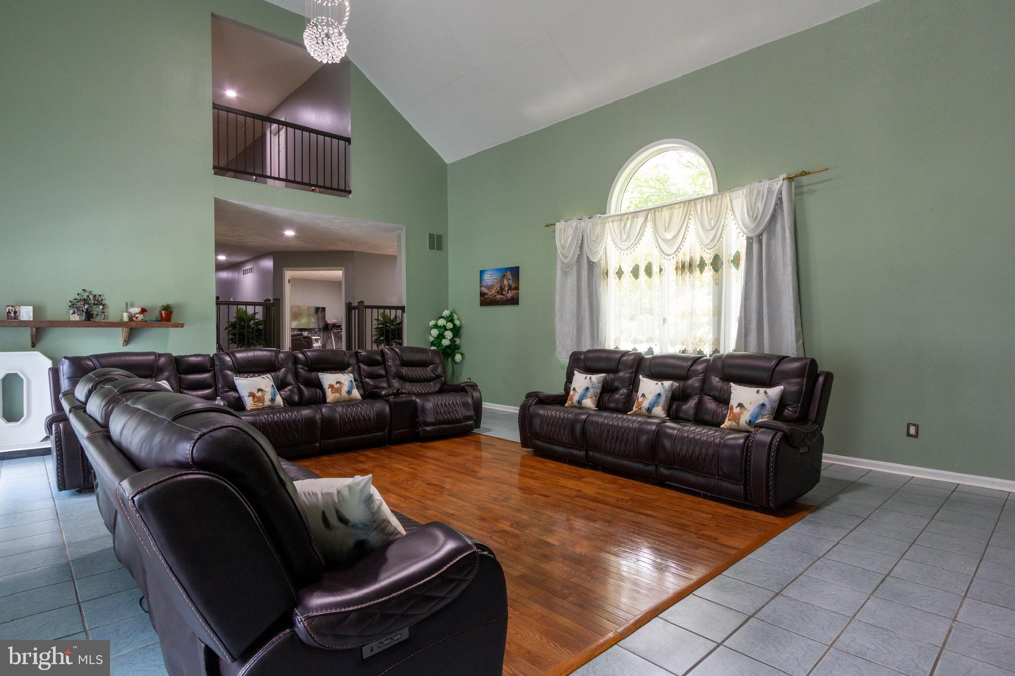 911 South Wieker Road Severn, MD 21144 - Photo 28 of 73 a living room with furniture and a large window