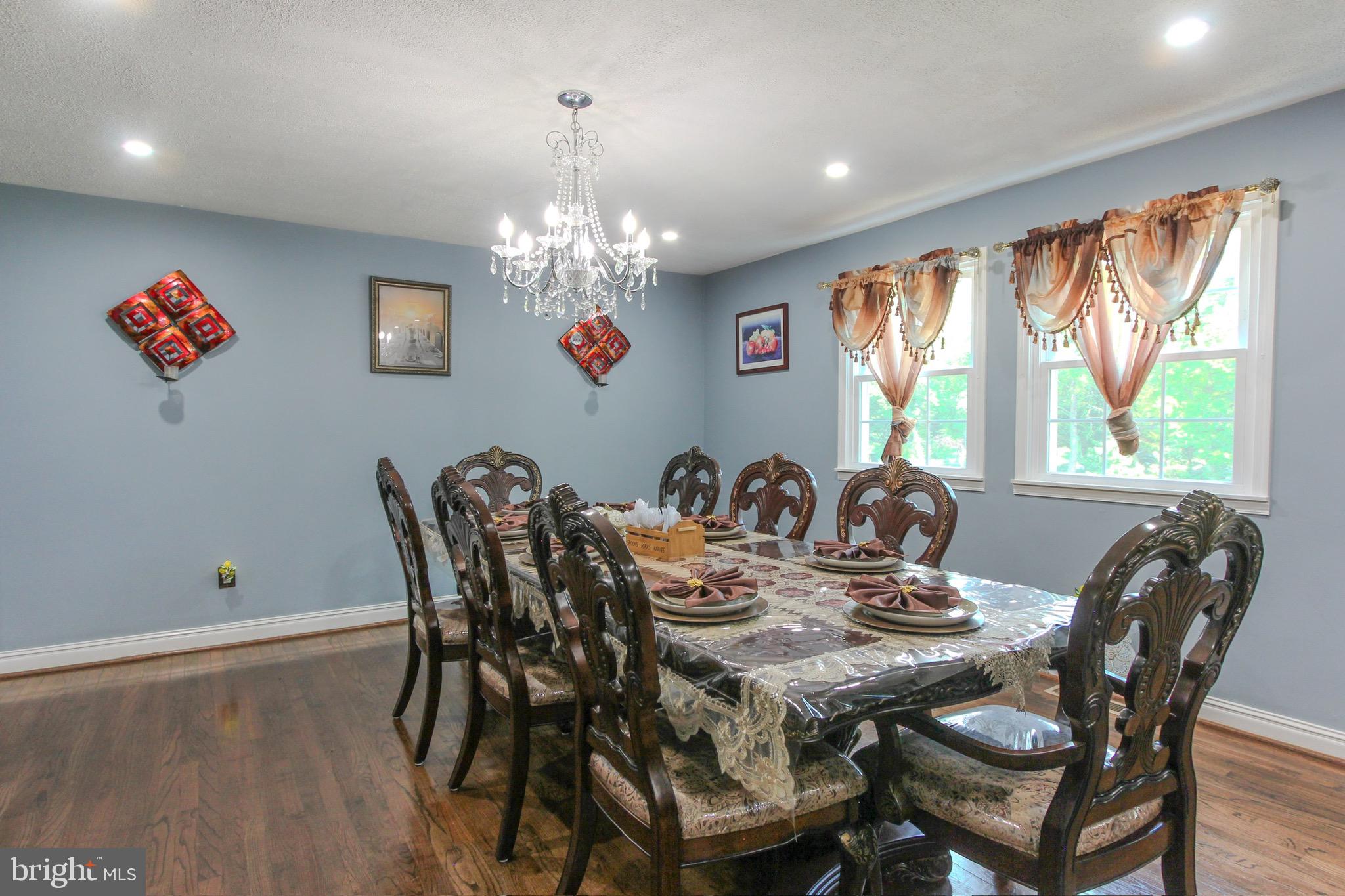 911 South Wieker Road Severn, MD 21144 - Photo 32 of 73 a view of a dining room with furniture window and outside view