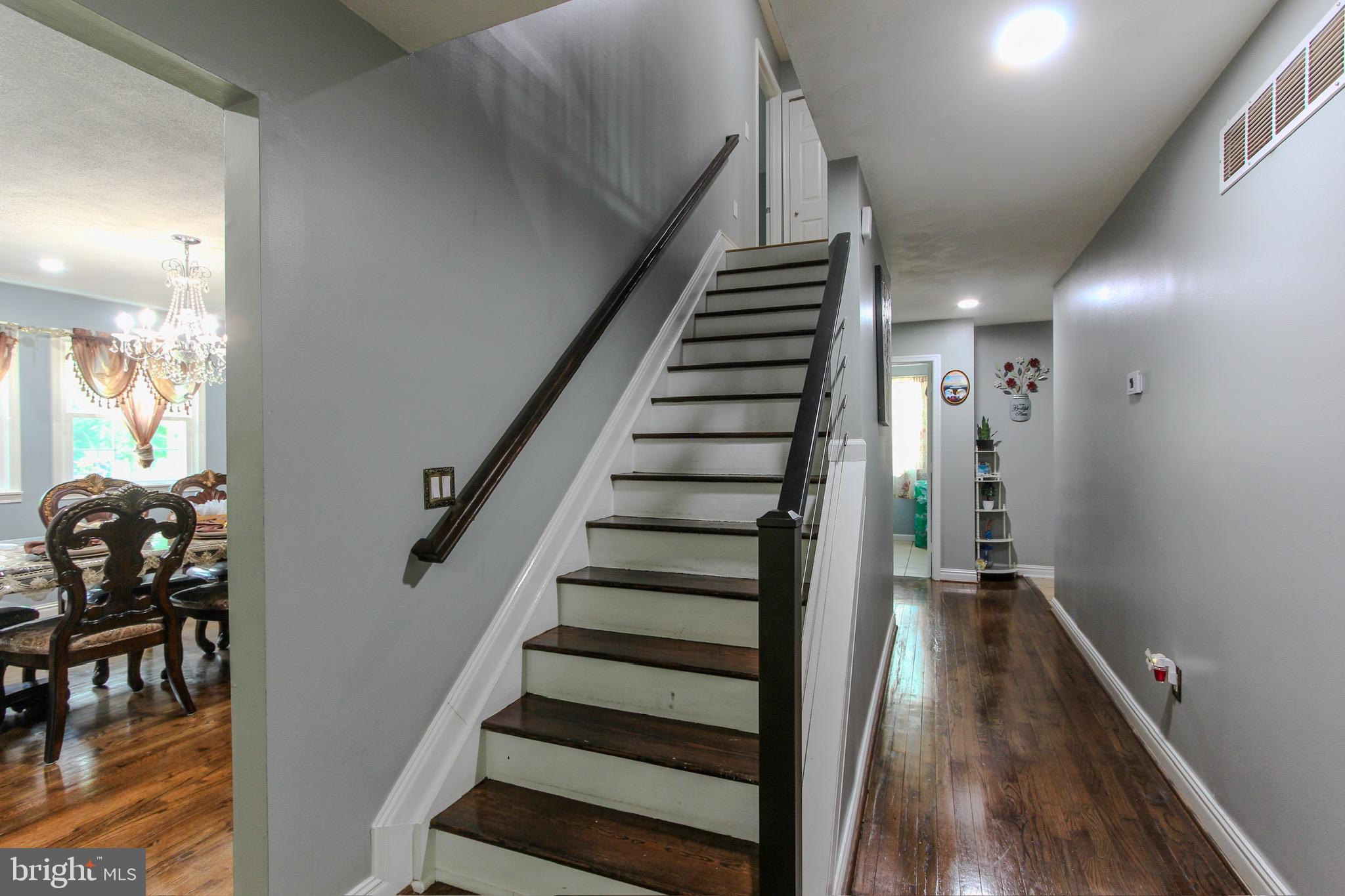 911 South Wieker Road Severn, MD 21144 - Photo 44 of 73 a view of entryway and hall with wooden floor