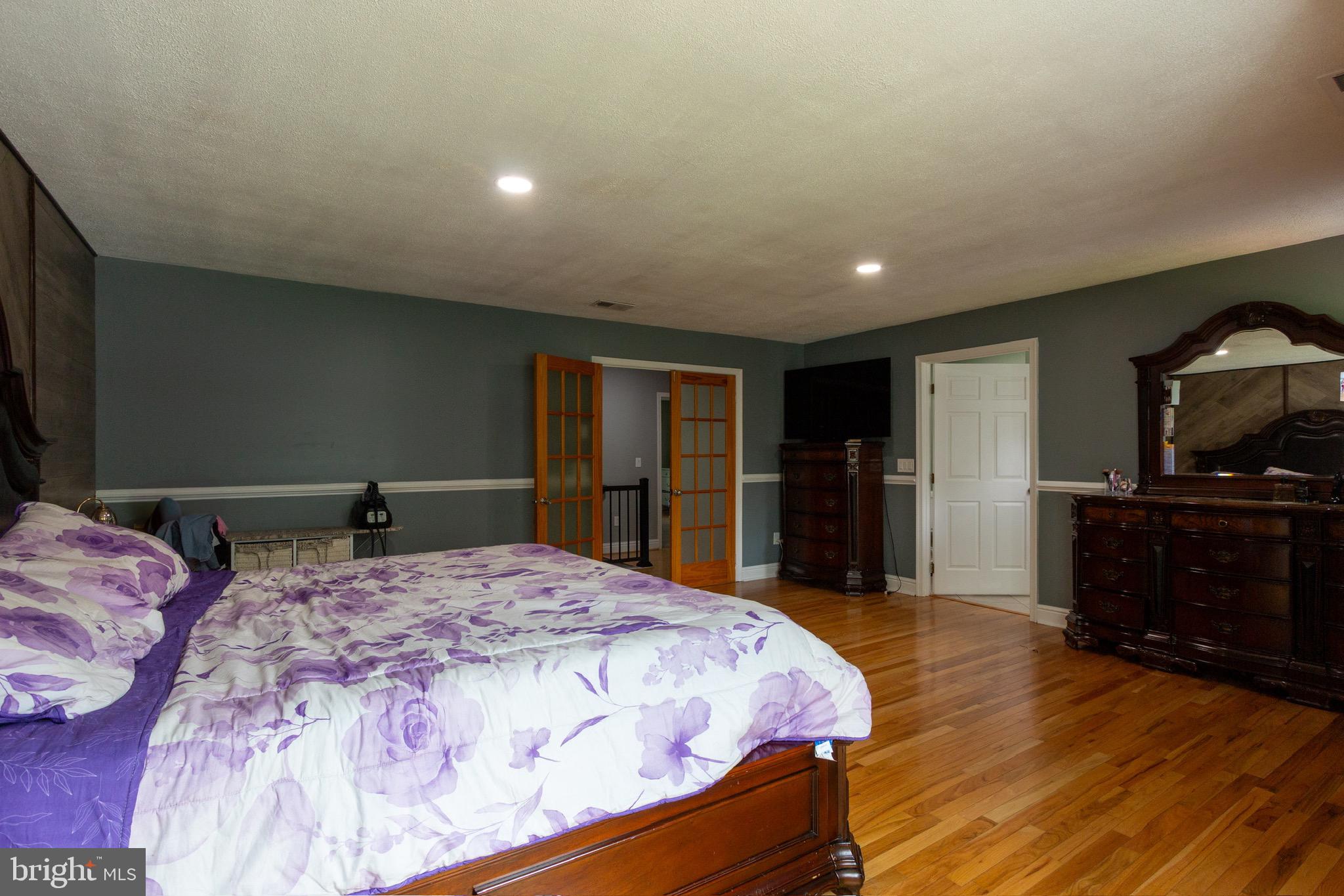 911 South Wieker Road Severn, MD 21144 - Photo 50 of 73 a bed room with a bed and a television
