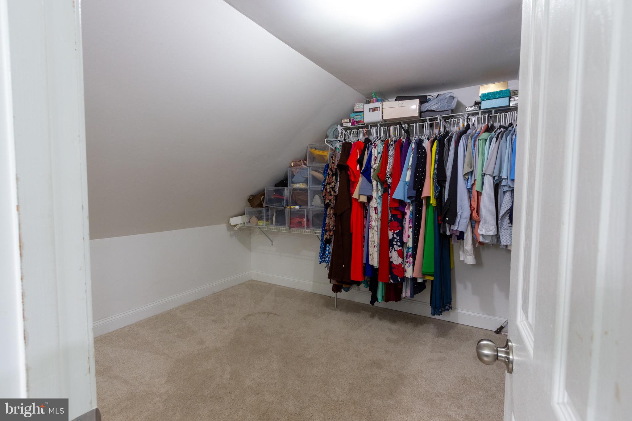 911 South Wieker Road Severn, MD 21144 - Photo 54 of 73 a view of walk in closet with clothes