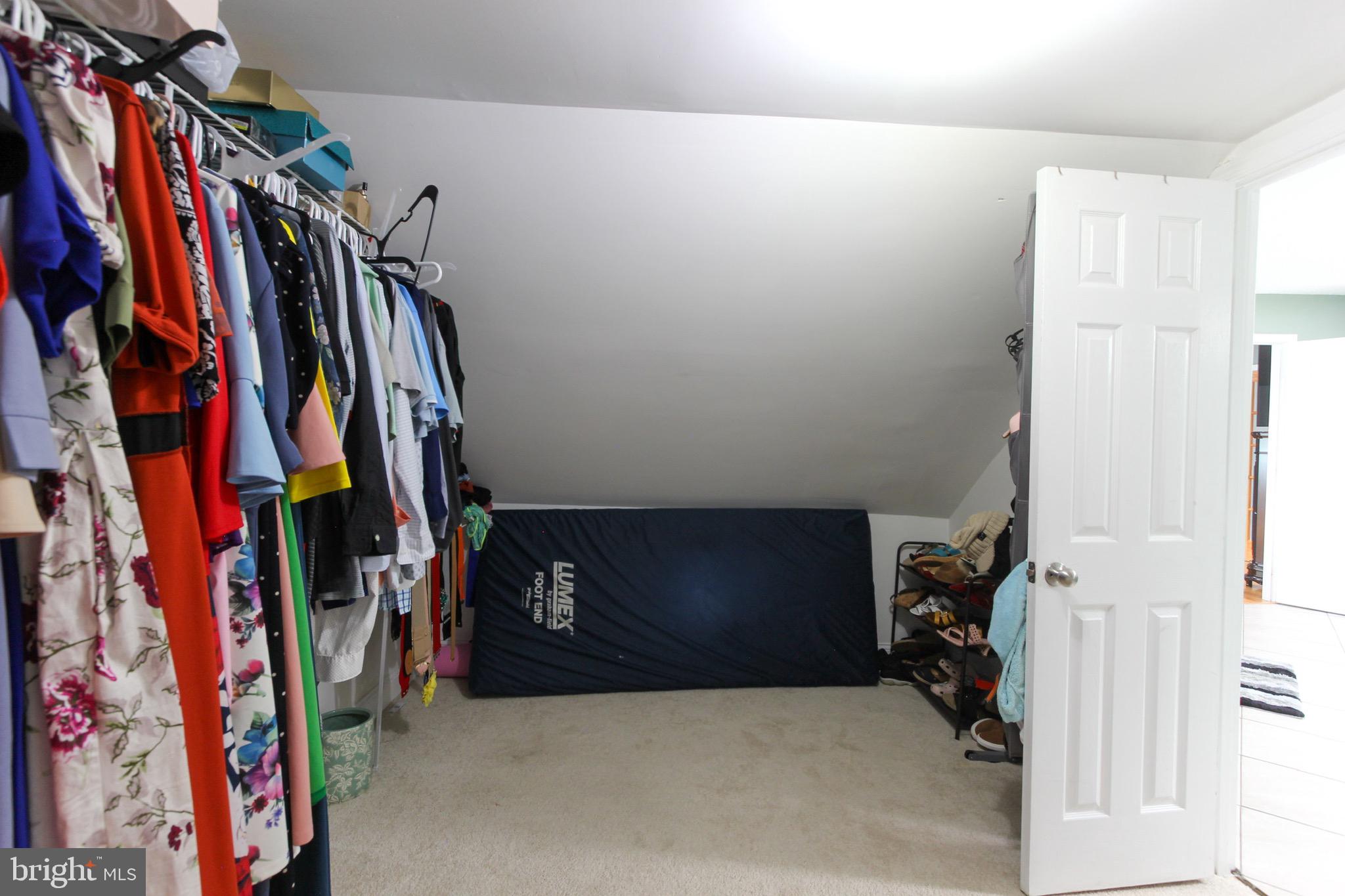 911 South Wieker Road Severn, MD 21144 - Photo 56 of 73 a view of walk in closet with clothes