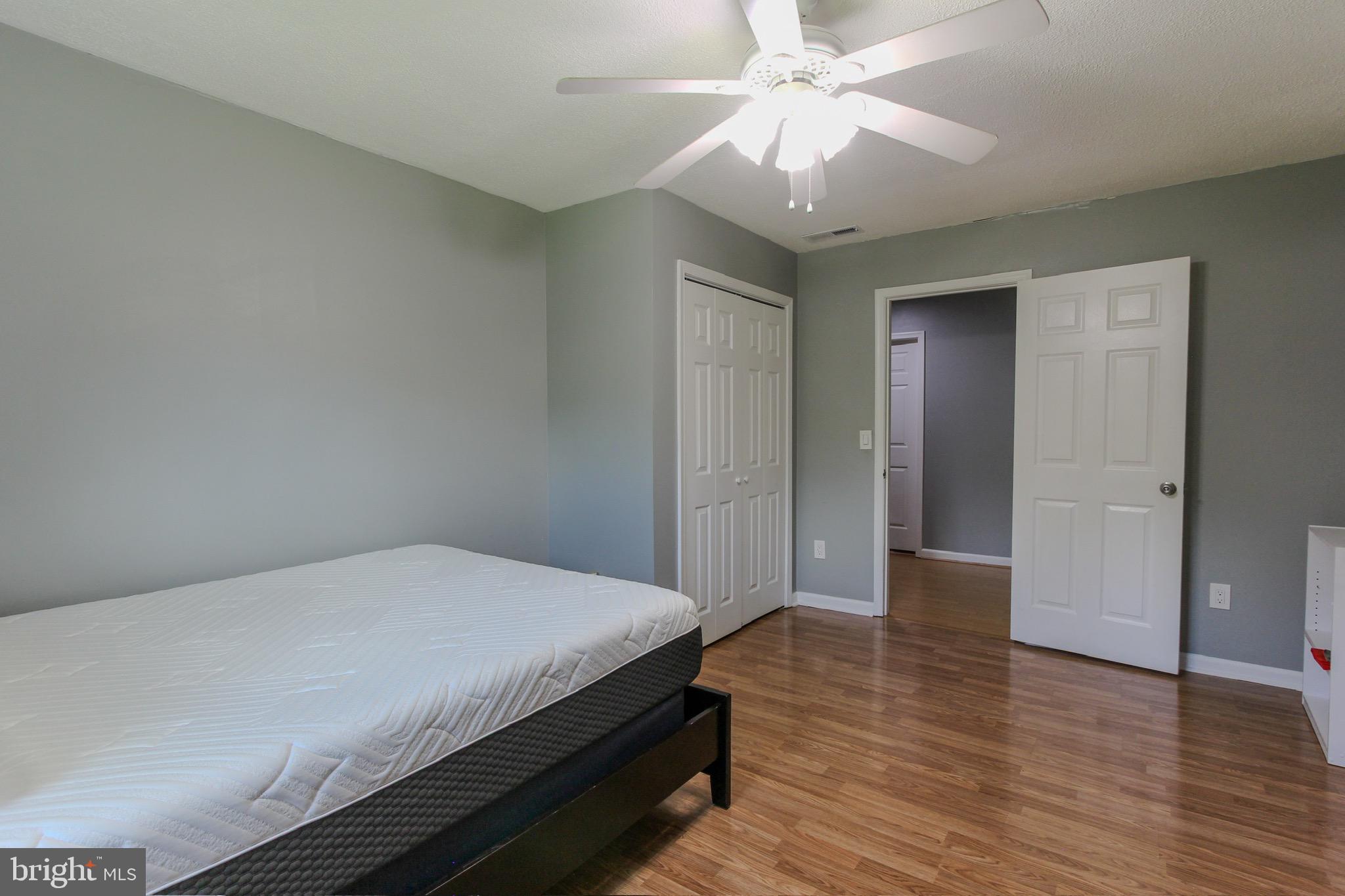 911 South Wieker Road Severn, MD 21144 - Photo 61 of 73 a bedroom with a bed and a chandelier