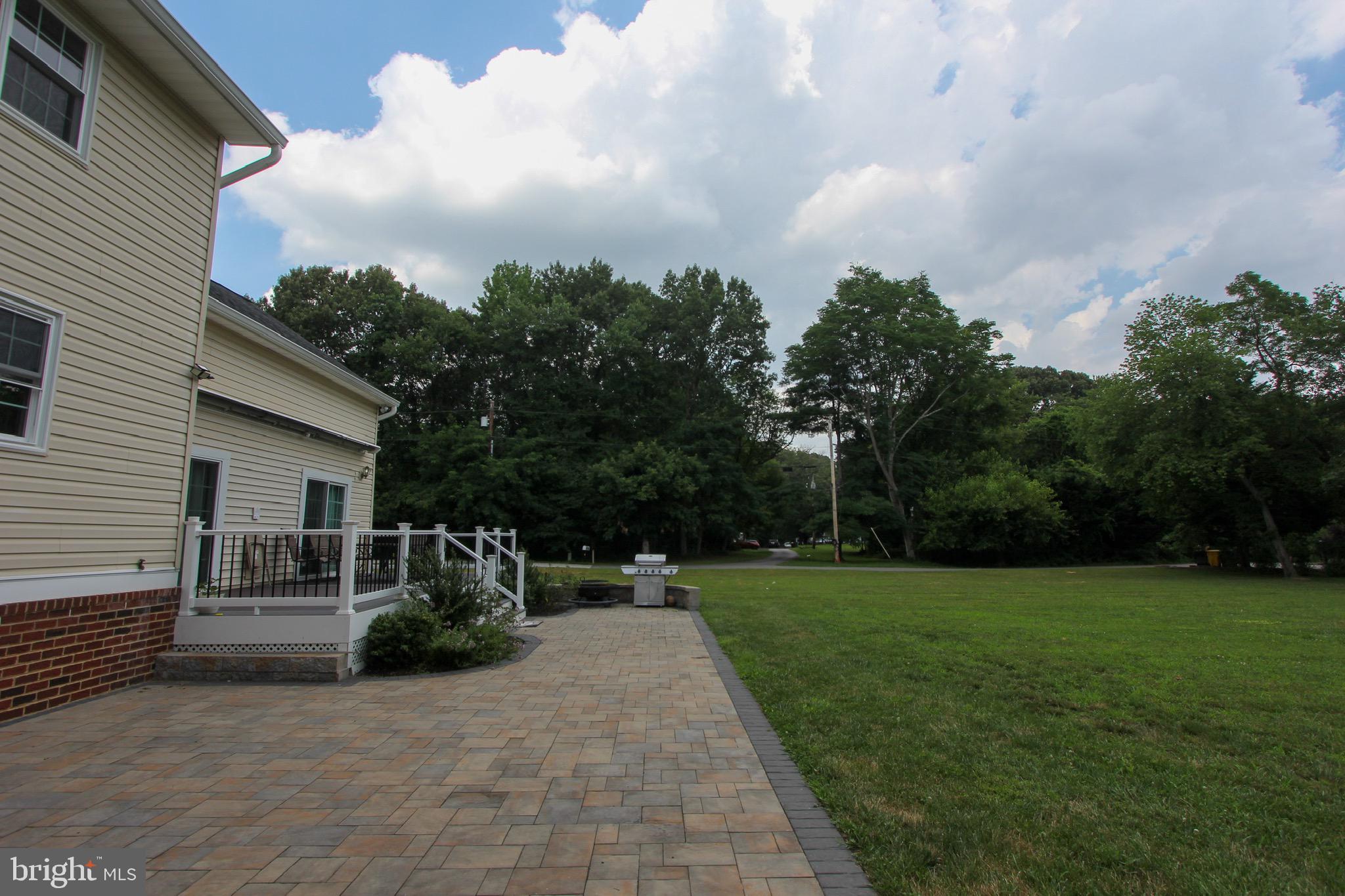 911 South Wieker Road Severn, MD 21144 - Photo 8 of 73 a view of a house with backyard and garden