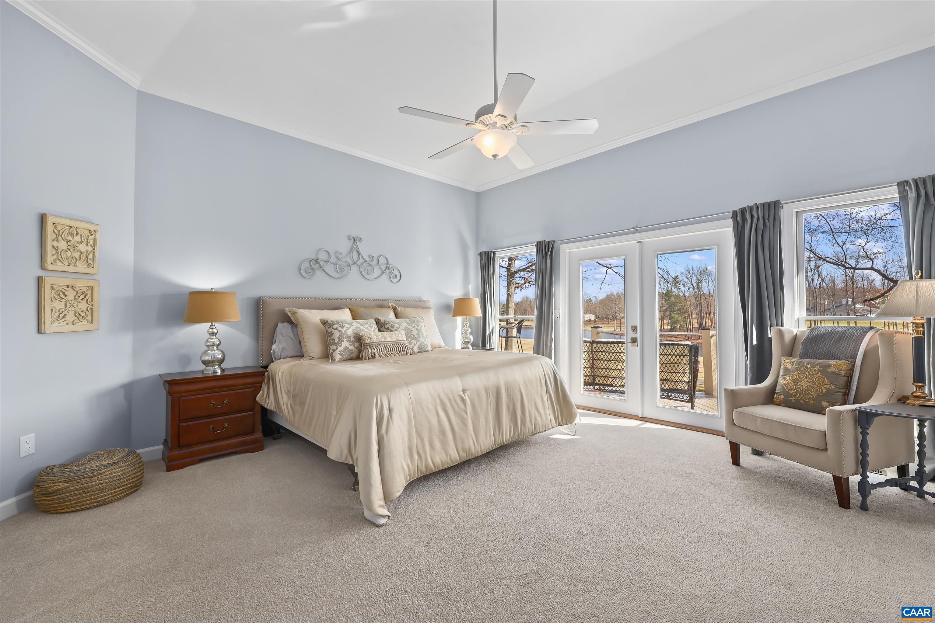 16 Oak Grove Road Palmyra, VA 22963 - Photo 23 of 53 a spacious bedroom with a bed and a chandelier