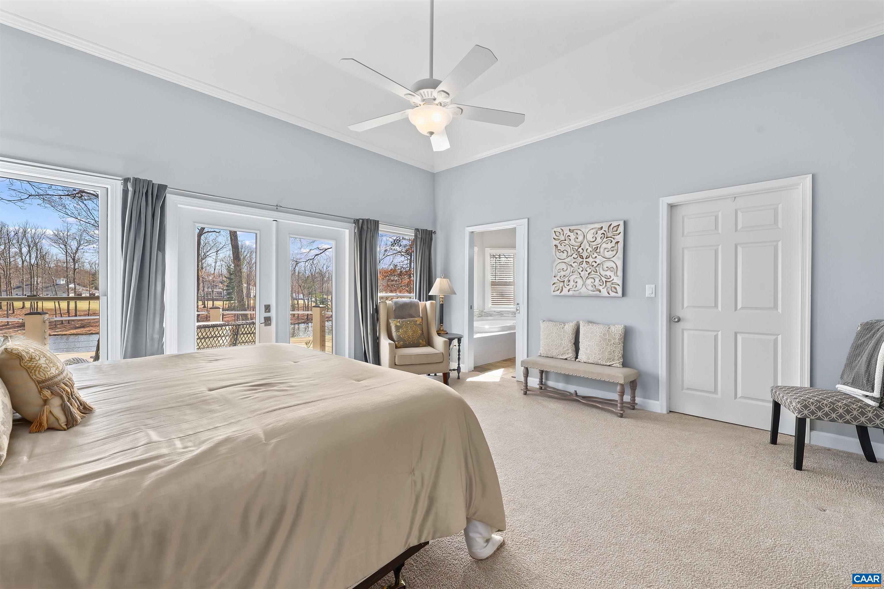 16 Oak Grove Road Palmyra, VA 22963 - Photo 24 of 53 a spacious bedroom with a large bed couch and a window