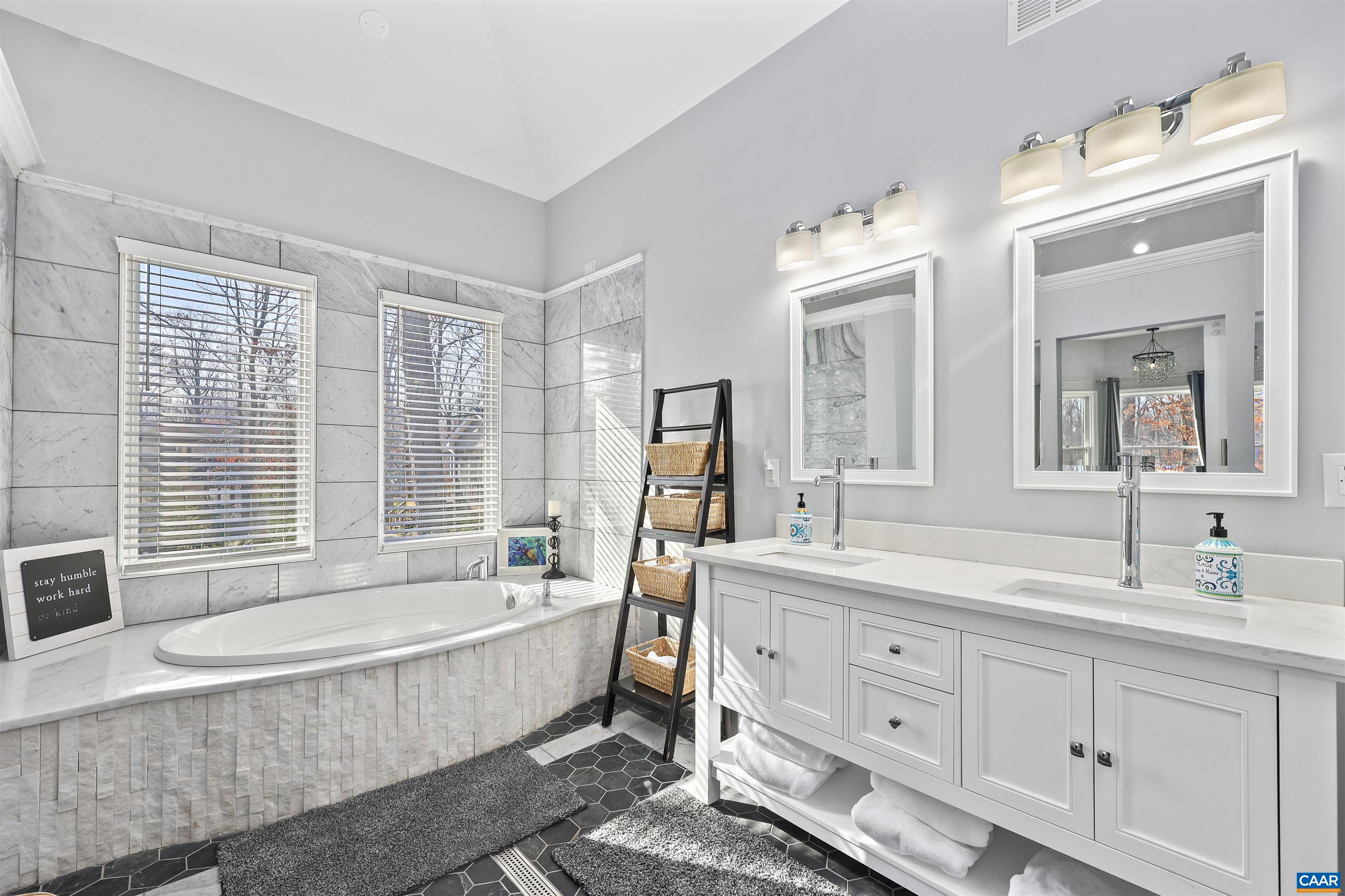 16 Oak Grove Road Palmyra, VA 22963 - Photo 33 of 53 a spacious bathroom with sink double vanity granite tub shower and mirror