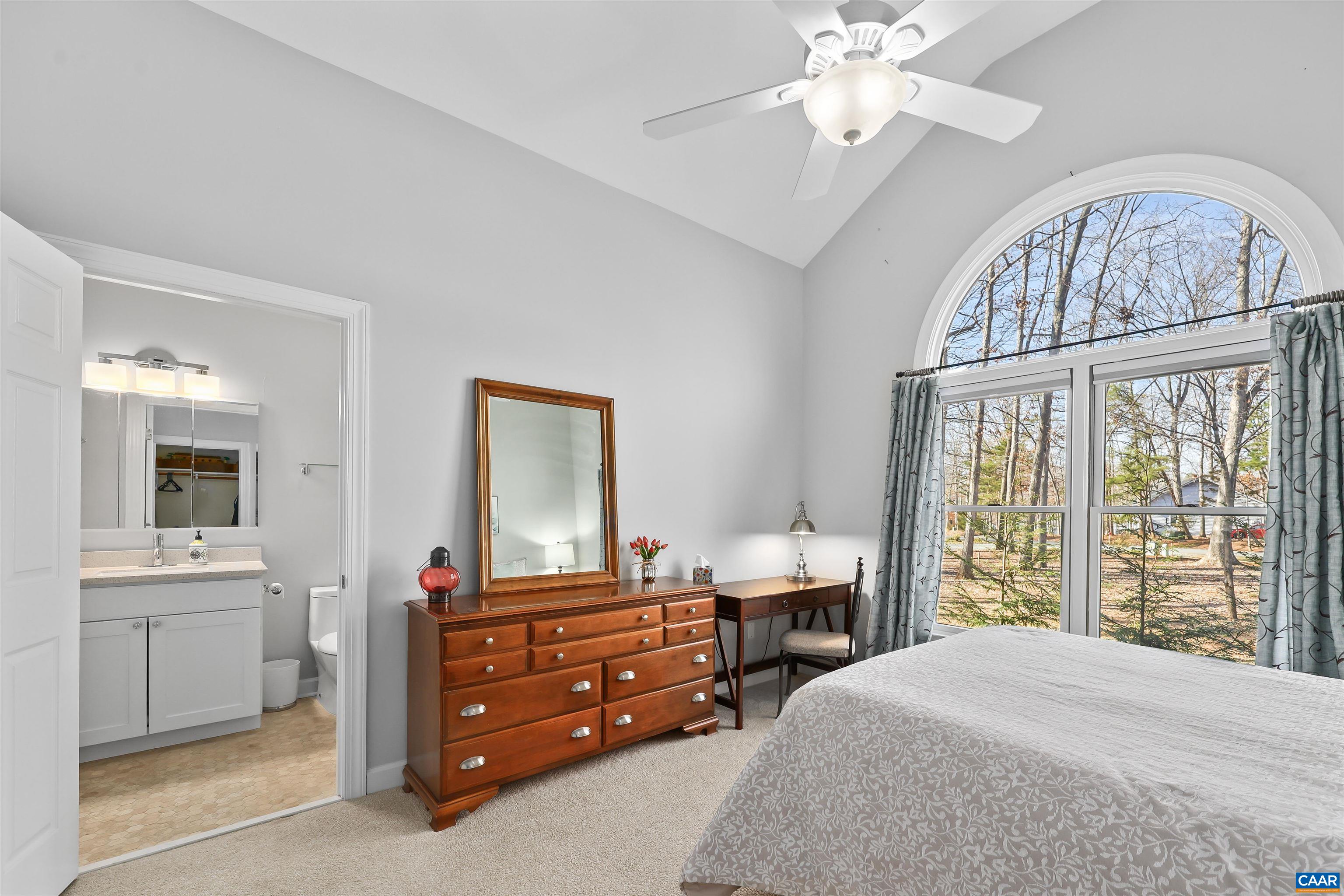 16 Oak Grove Road Palmyra, VA 22963 - Photo 34 of 53 a bedroom with a bed and a chandelier