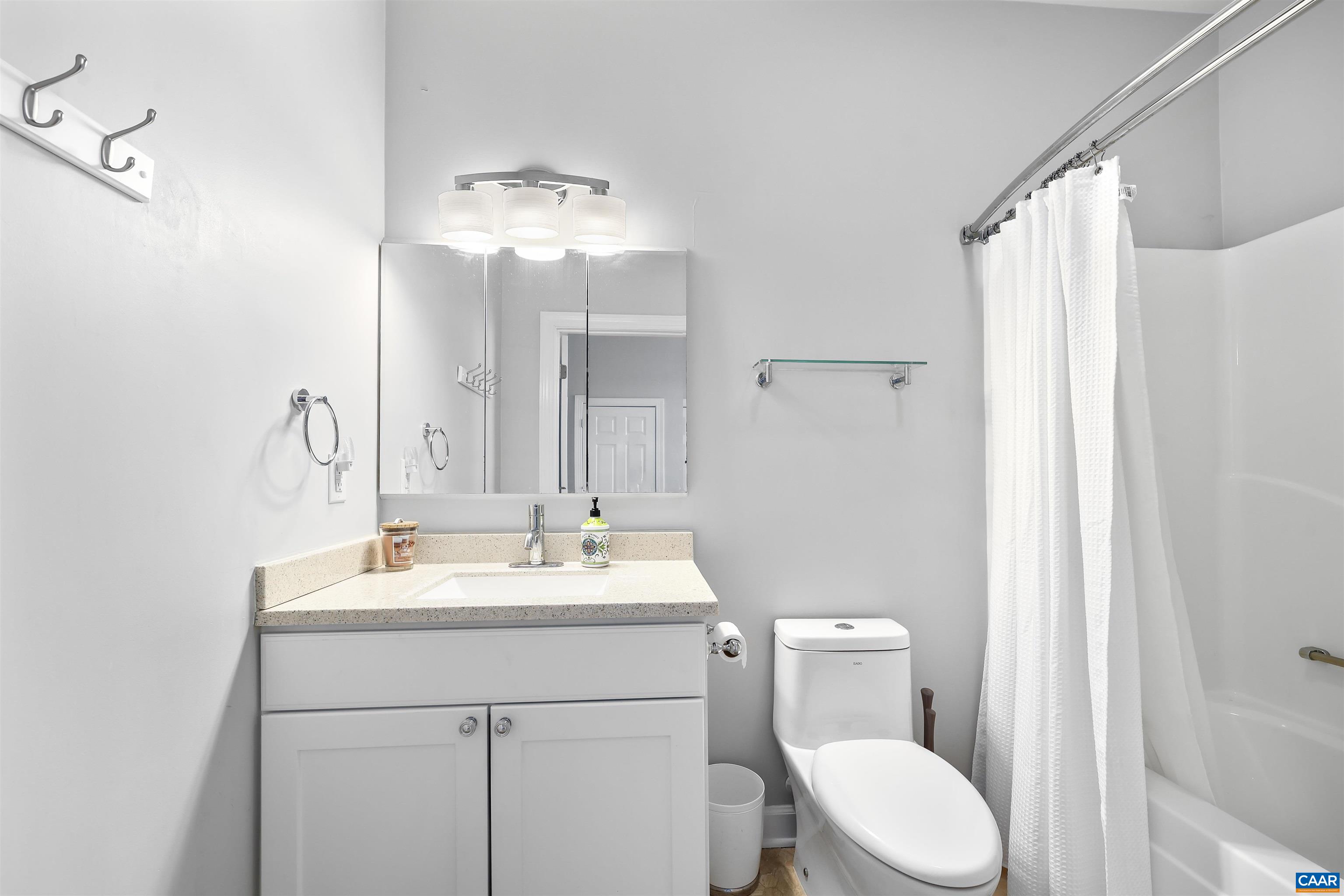 16 Oak Grove Road Palmyra, VA 22963 - Photo 36 of 53 a bathroom with a toilet sink shower and mirror