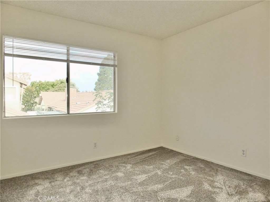 14431 Raintree Road Tustin, CA 92780 - Photo 26 of 53 an empty room with a window