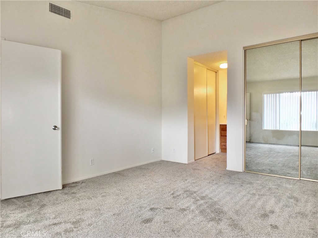 14431 Raintree Road Tustin, CA 92780 - Photo 28 of 53 an empty room with a mirror