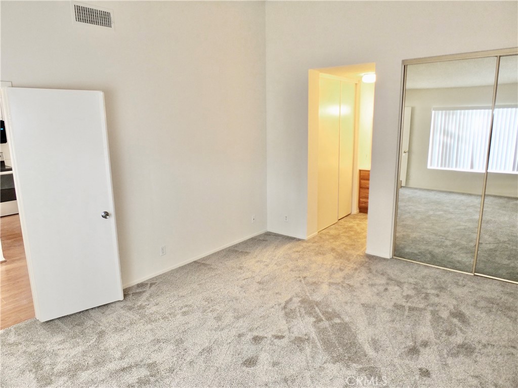 14431 Raintree Road Tustin, CA 92780 - Photo 29 of 53 an empty room with a bathroom and mirror