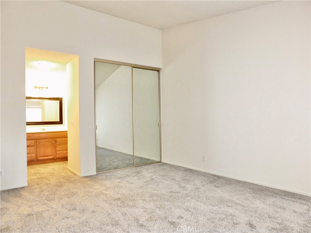 14431 Raintree Road Tustin, CA 92780 - Photo 30 of 53 an empty room with a door